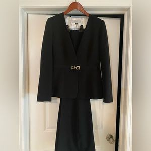 Black pants suit with gold detail.
